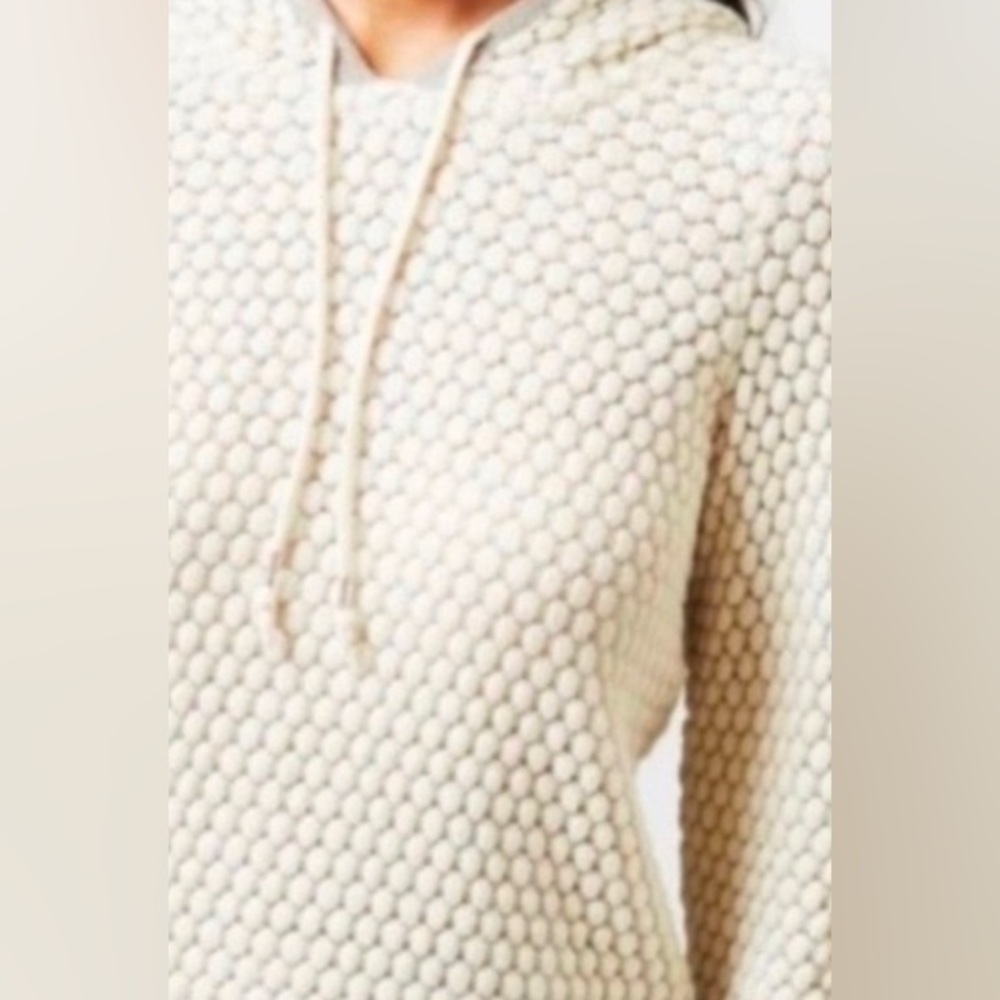 Anthropologie’s “Sleeping on Snow” silver thread hooded pullover
